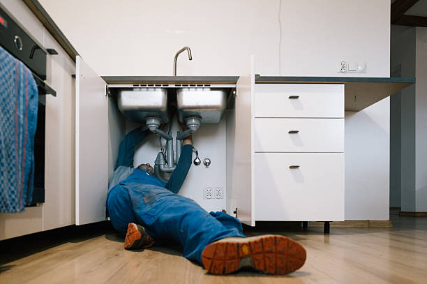 Professional Emergency Plumber technician working in Manistee, MI
